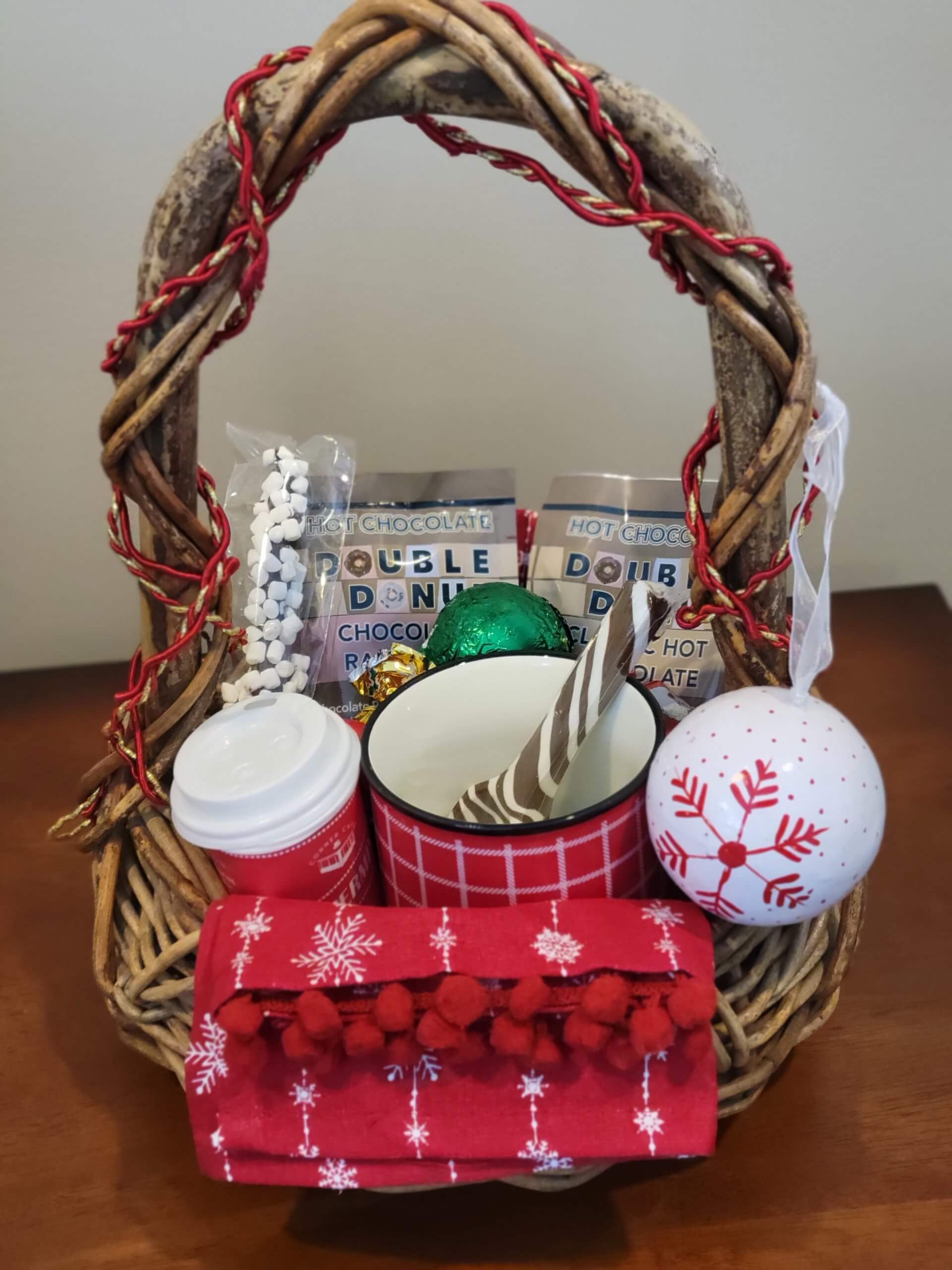 A basket with Gus, the Goodco Elf