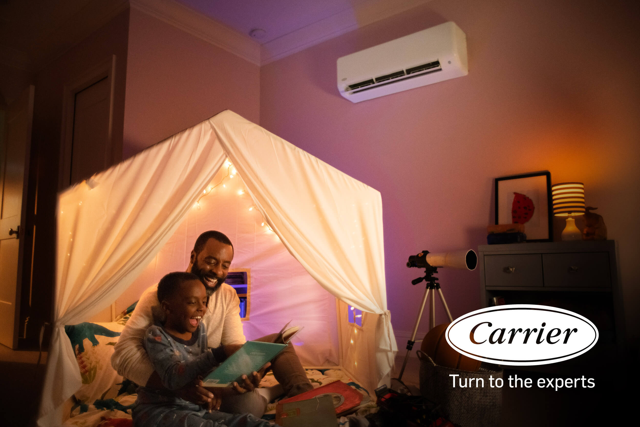 Father and son reading in a blanket fort. Carrier® Turn to the Experts. Father and son reading in a blanket fort. Carrier® Turn to the Experts.